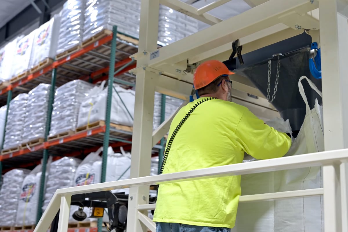 Malteurop Employee loading up tote bag